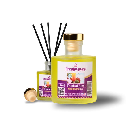 Tropical Bliss Diffuser with vibrant yellow oil in elegant glass bottle, black reeds, and gold cap for a fragrant home amb...